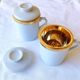 2 white and gold Limoges porcelain tea cups
