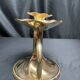 Brass candlestick in a fluted shape from the early 20th century.
