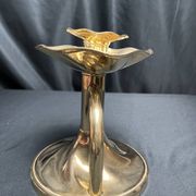 Brass candlestick in a fluted shape from the early 20th century.