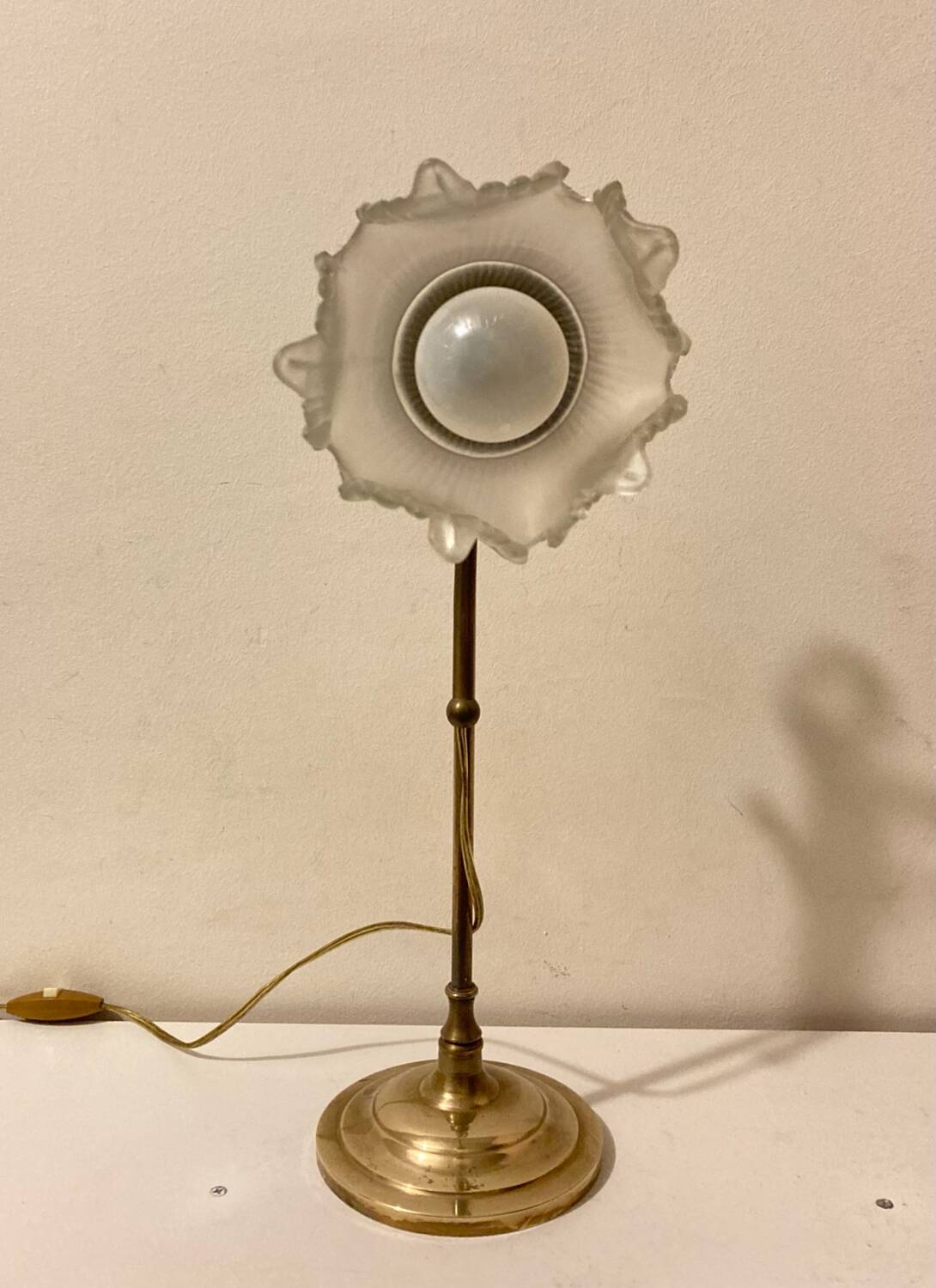 Brass table lamp with a glass shade