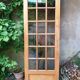 Old wooden door glazed with small tiles