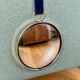 Vintage witch's eye curved mirror hangs velvet ribbon