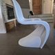 10 white chairs in the style of Verner Panton