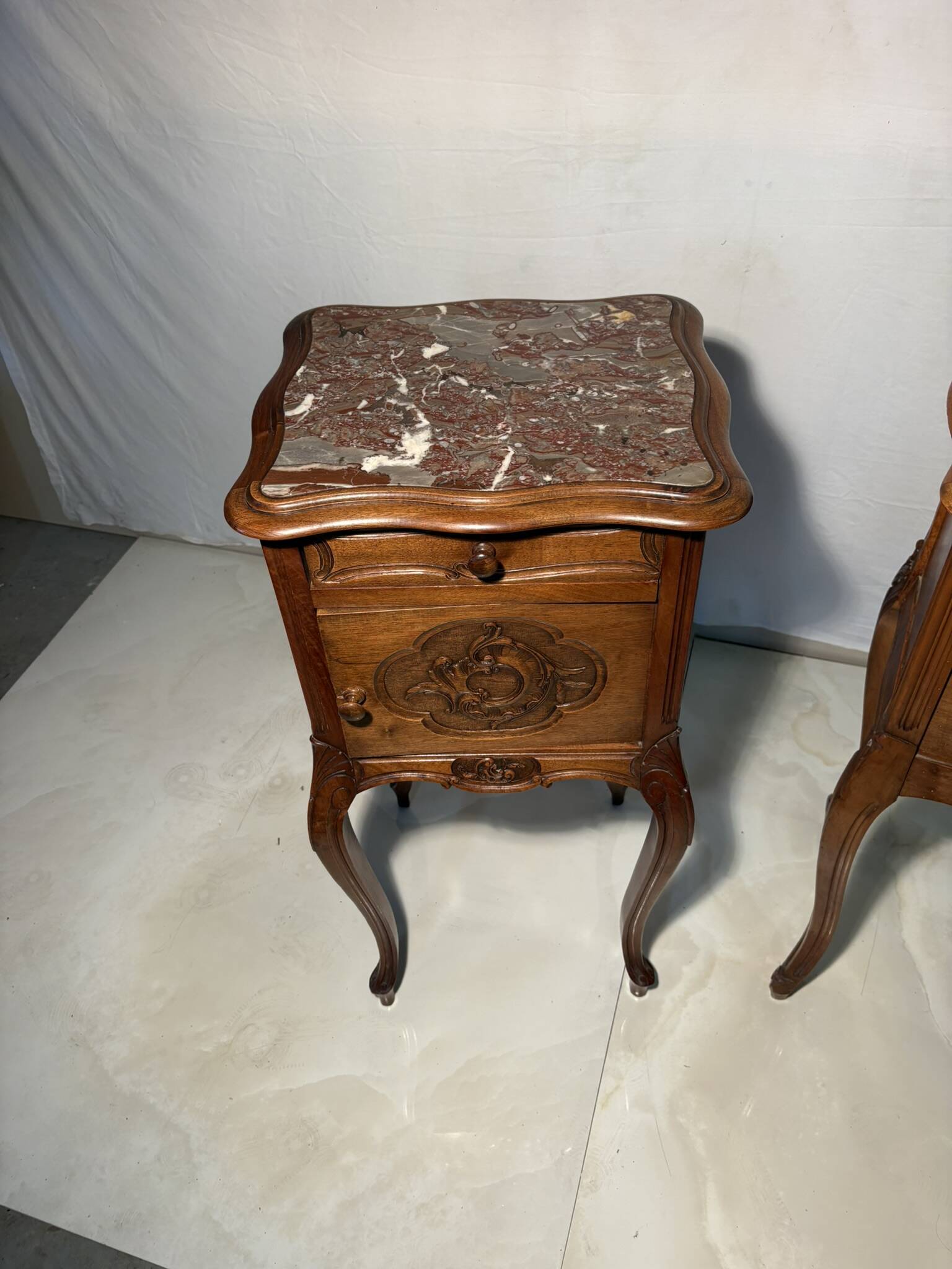 Pair of antique bedside tables with marble top and ceramic niche