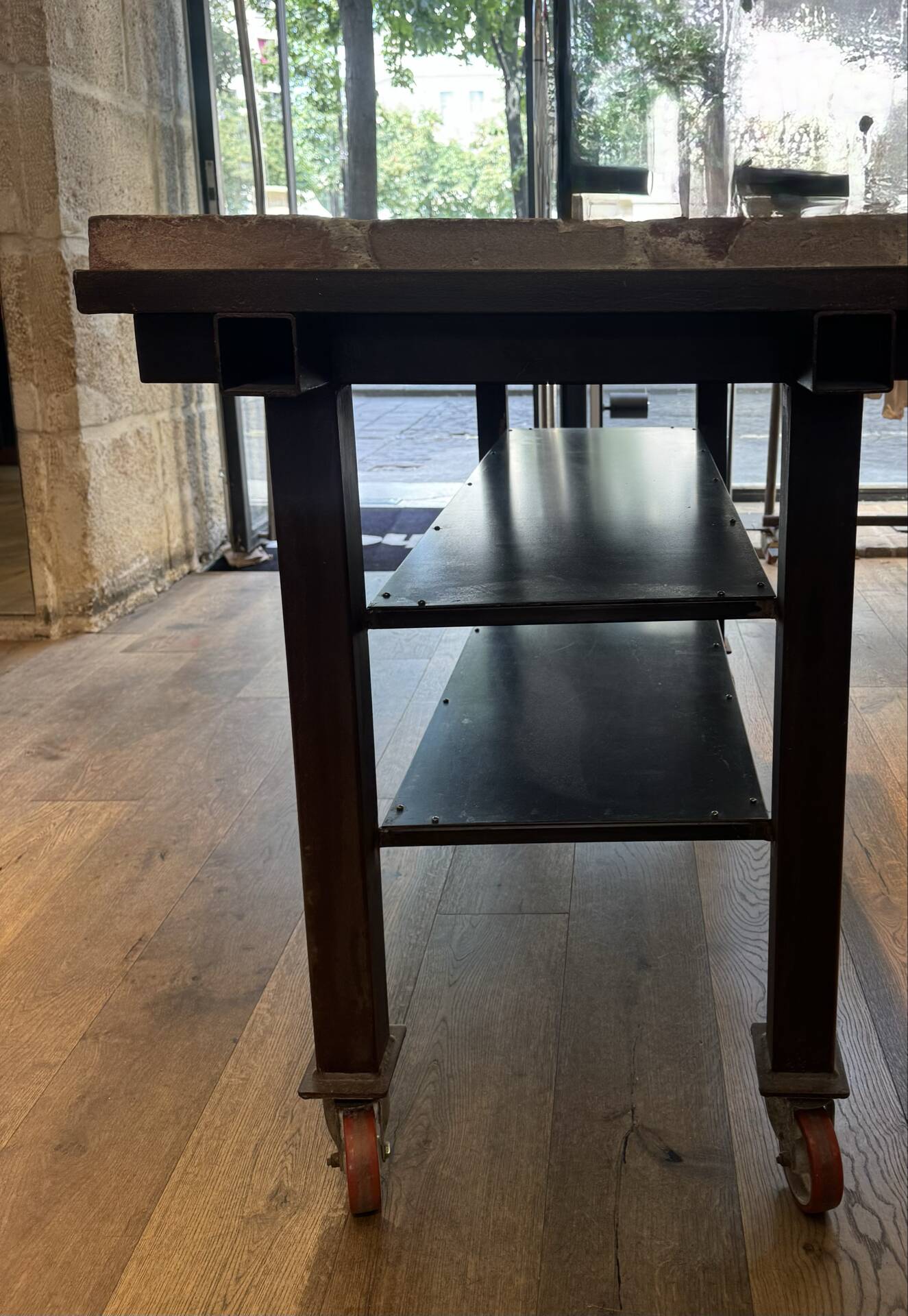 Industrial style creator table in bricks and metal on wheels.