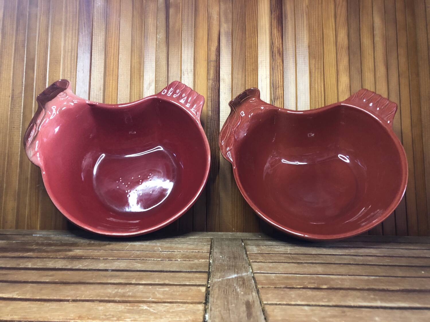 Pair of red ceramic hen dish