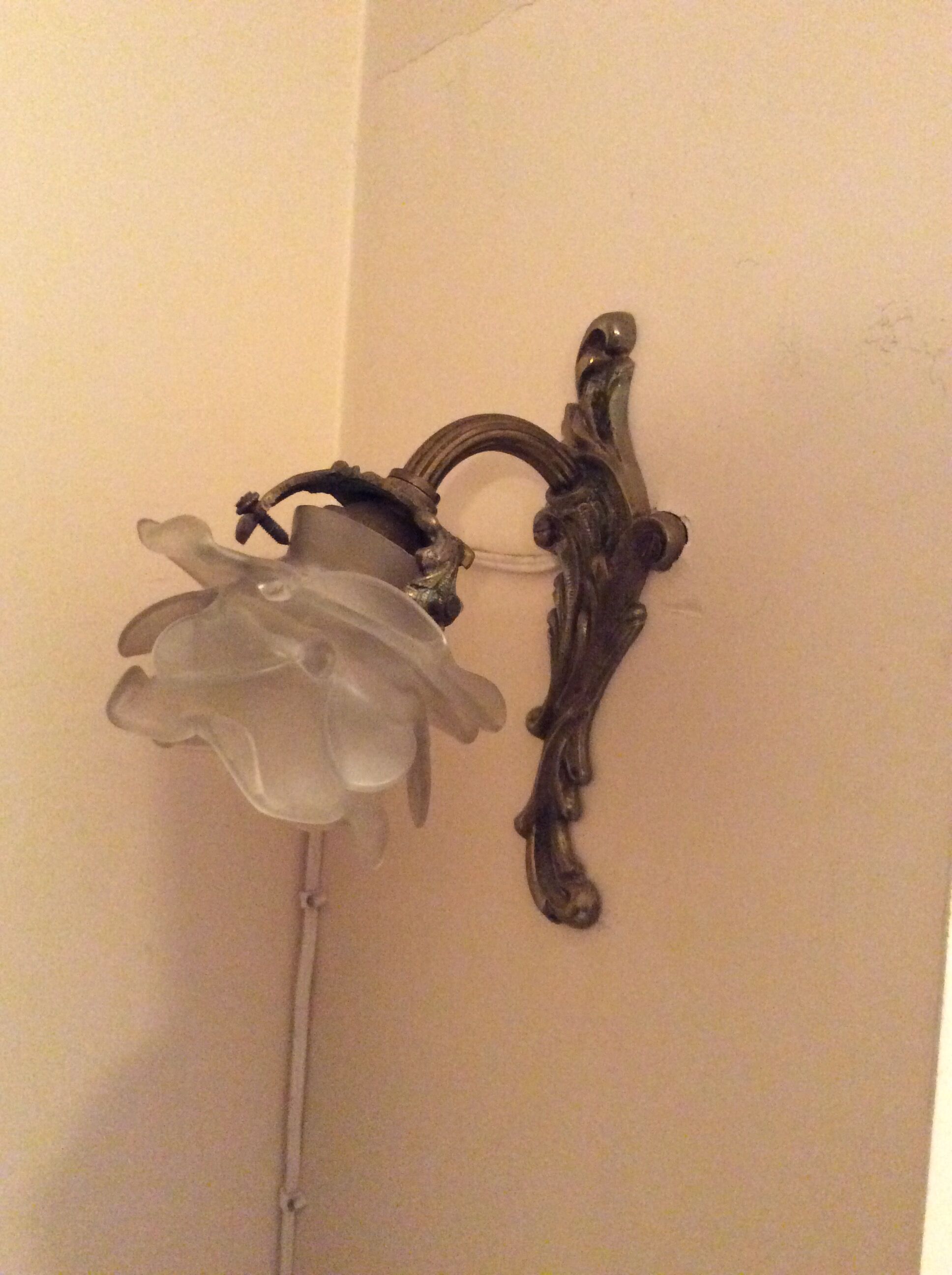 Old wall lamp in bronze and glass
