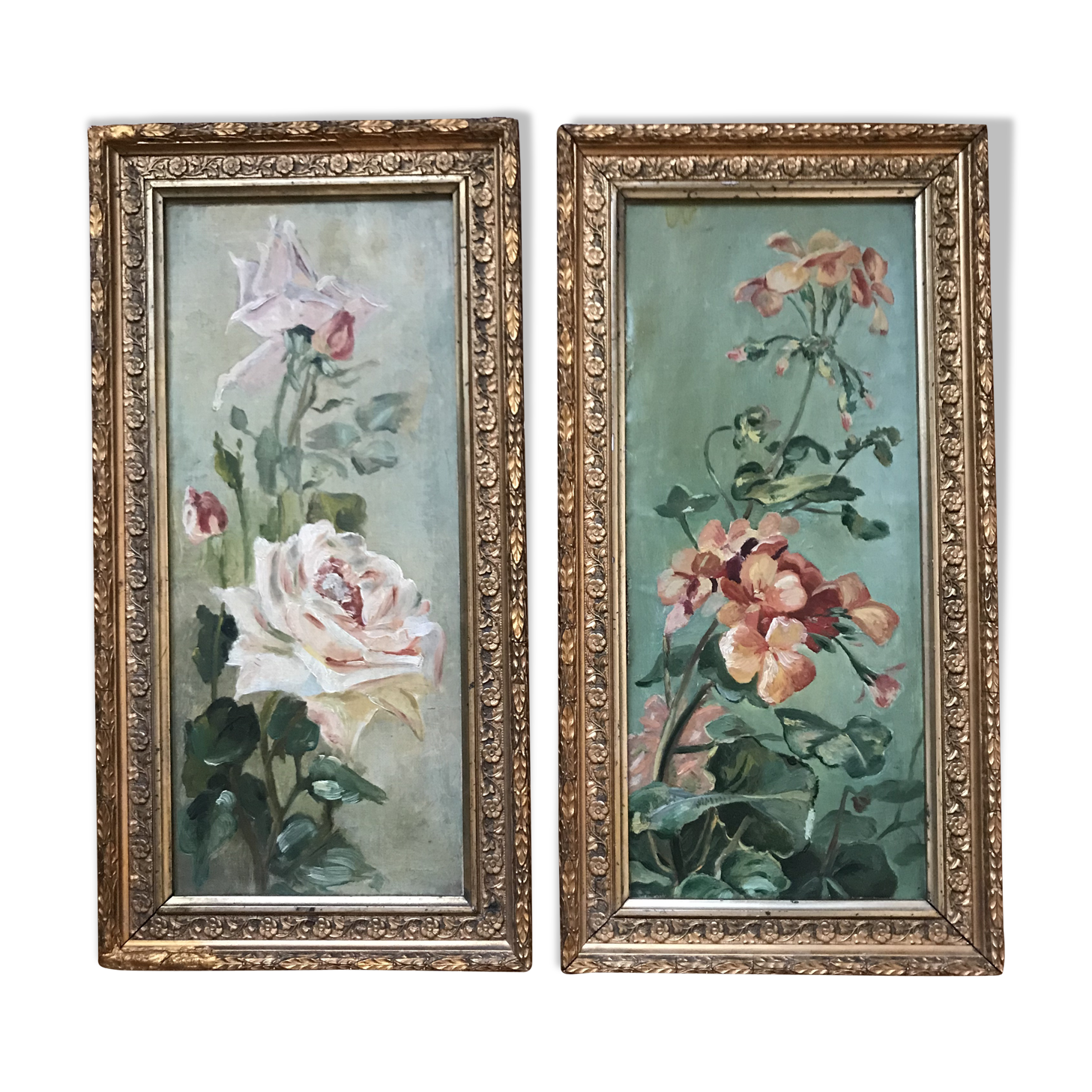 Two old paintings of flowers and gilded frames