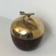 Apple-shaped ice bucket in red celluloid, gold-tone metal and plastic