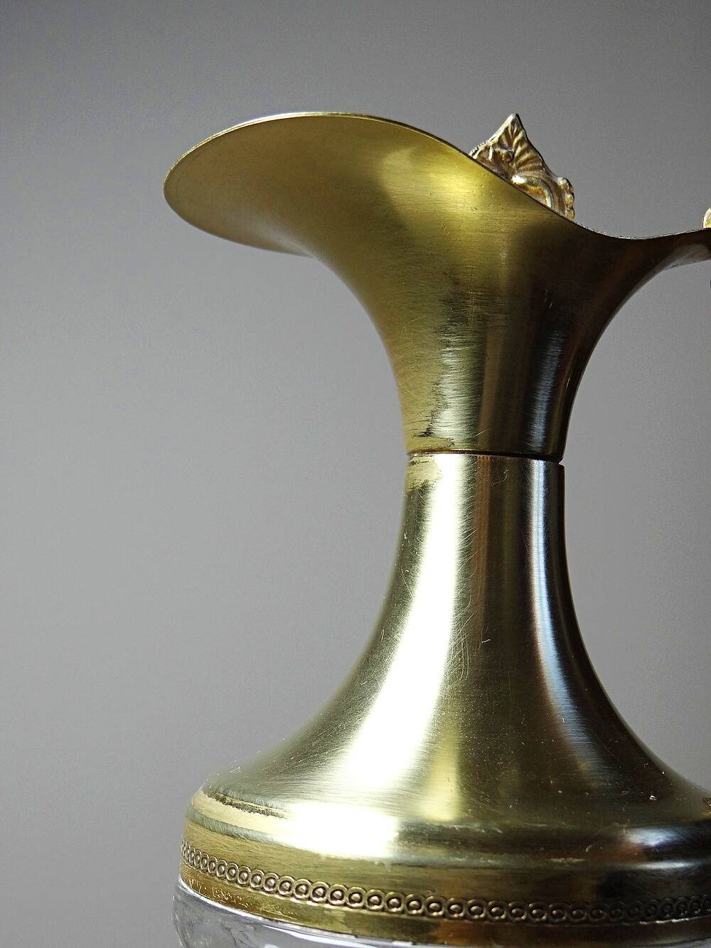 Vintage decorative jug in moulded glass and gilded brass, Italy circa 1980.