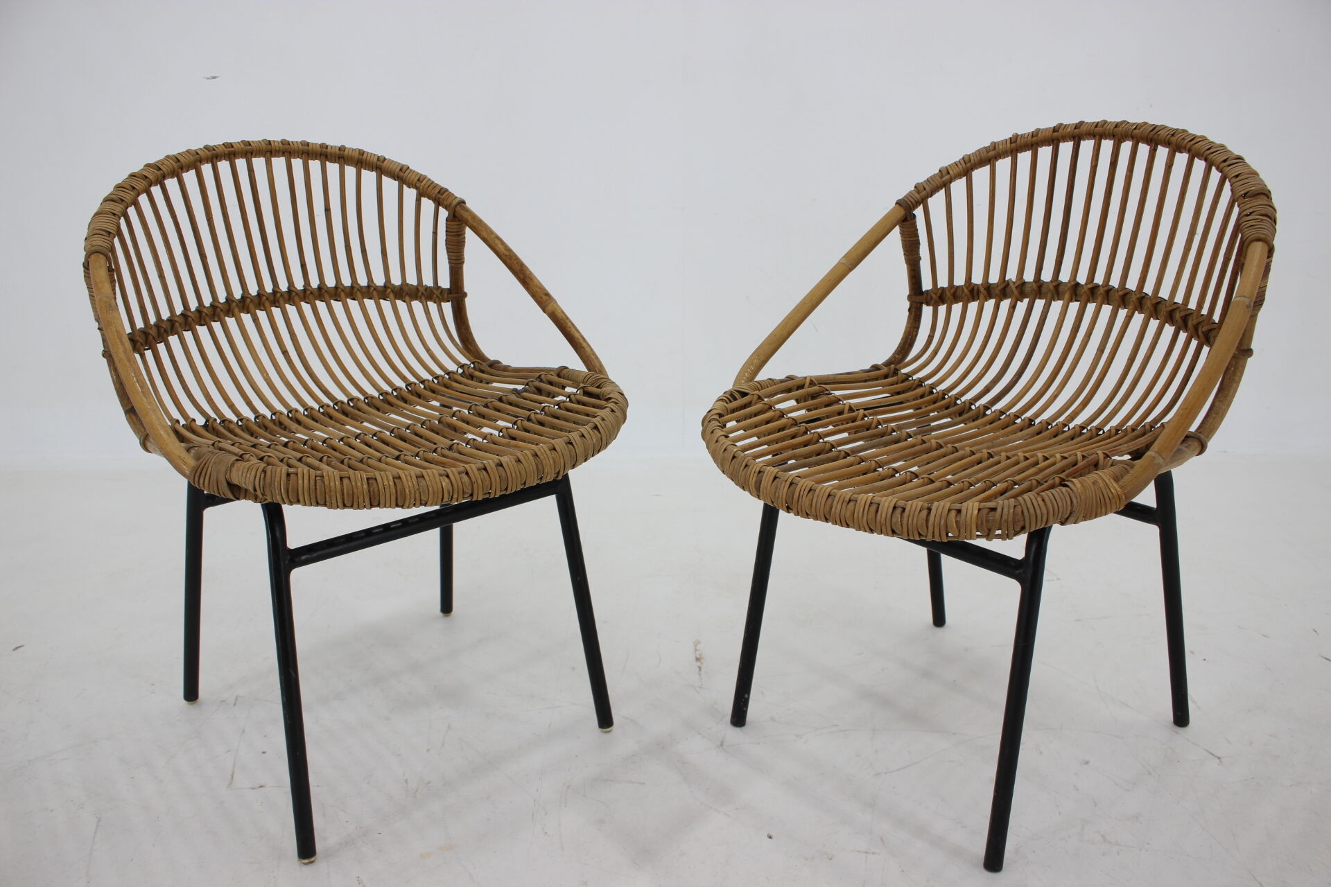 1970s pair of Alan Fuchs rattan and iron lounge chairs, Czechoslovakia