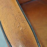 Sheep leather and wooden Art Deco design armchair with ball feet