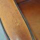 Sheep leather and wooden Art Deco design armchair with ball feet