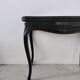 Molded blackened wooden play table, arched legs, green felt