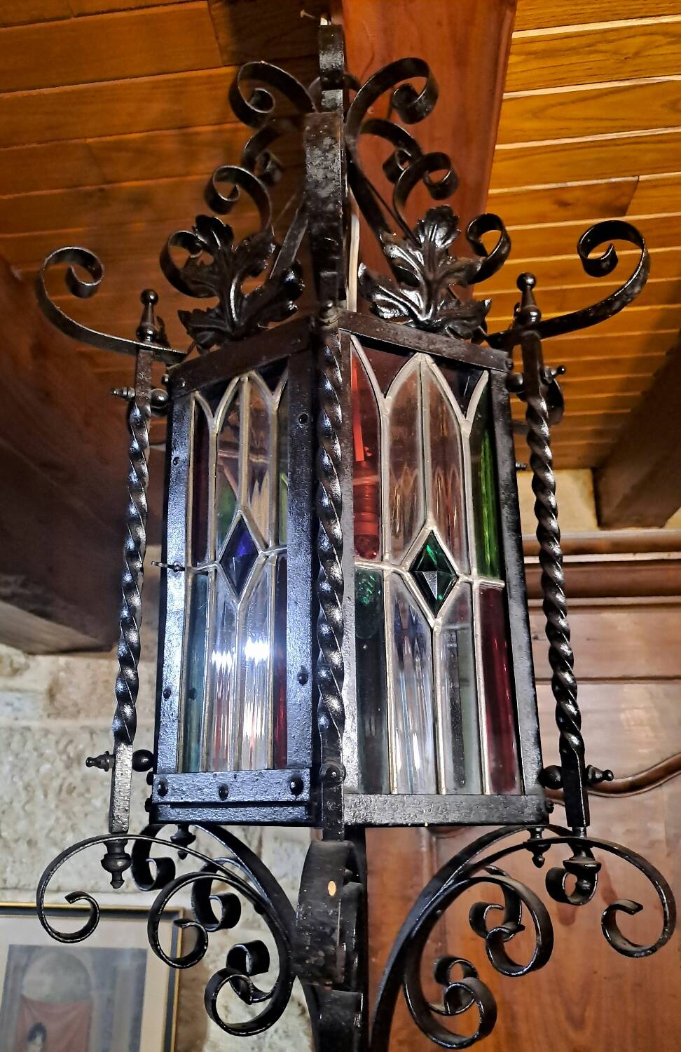 Wrought iron lantern with colored stained glass