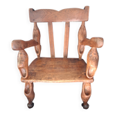 Child's chair in carved oak. Antique Breton furniture.