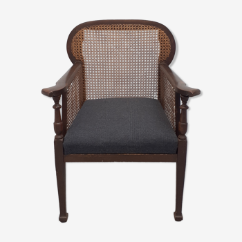 Colonial wooden armchair and cannage