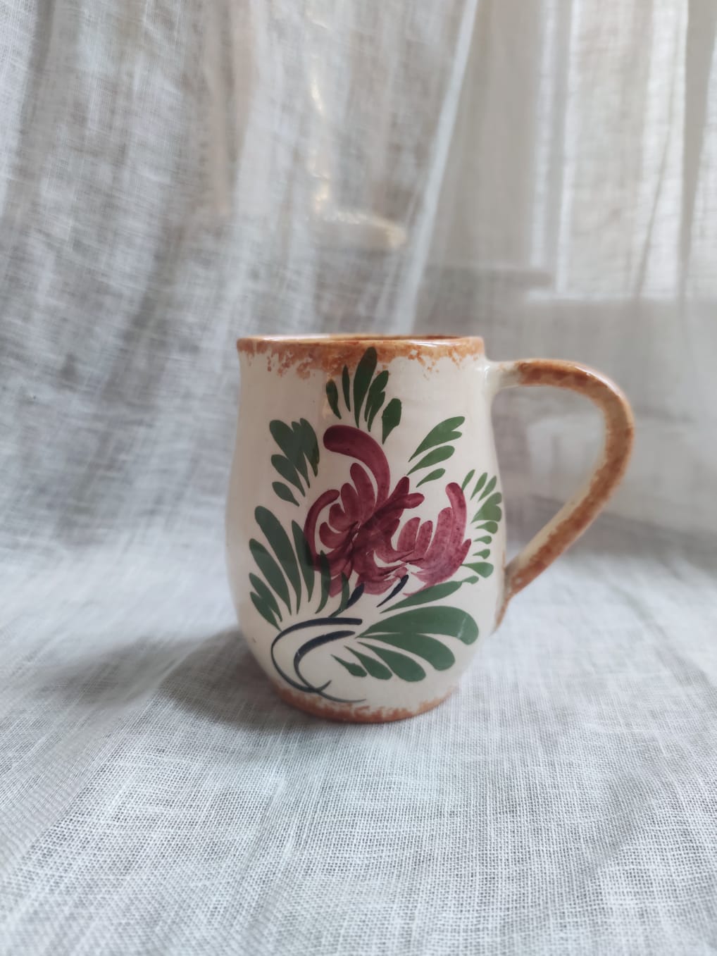 Small hand-painted pitcher