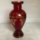 Cameo vase and red cabochons in burgundy glass
