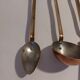 Vintage copper and brass kitchen utensils.