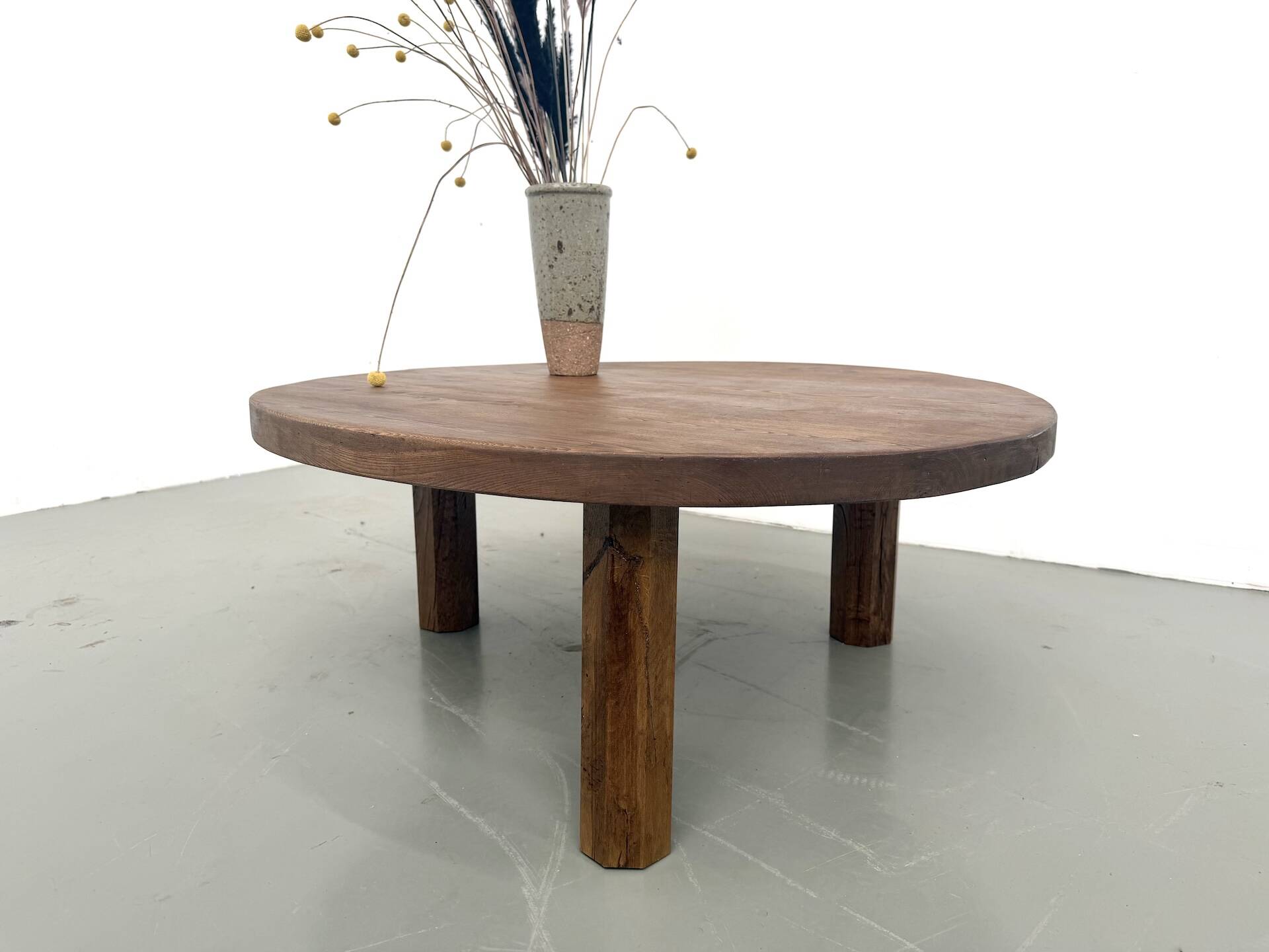 Round coffee table in solid oak, octagonal legs, France, 1950s.