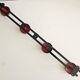 Wall-mounted coat rack in black and red metal (4 hooks)