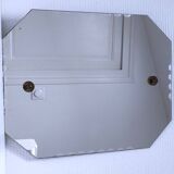 Octagonal mirror with brass hubcaps from the 60s