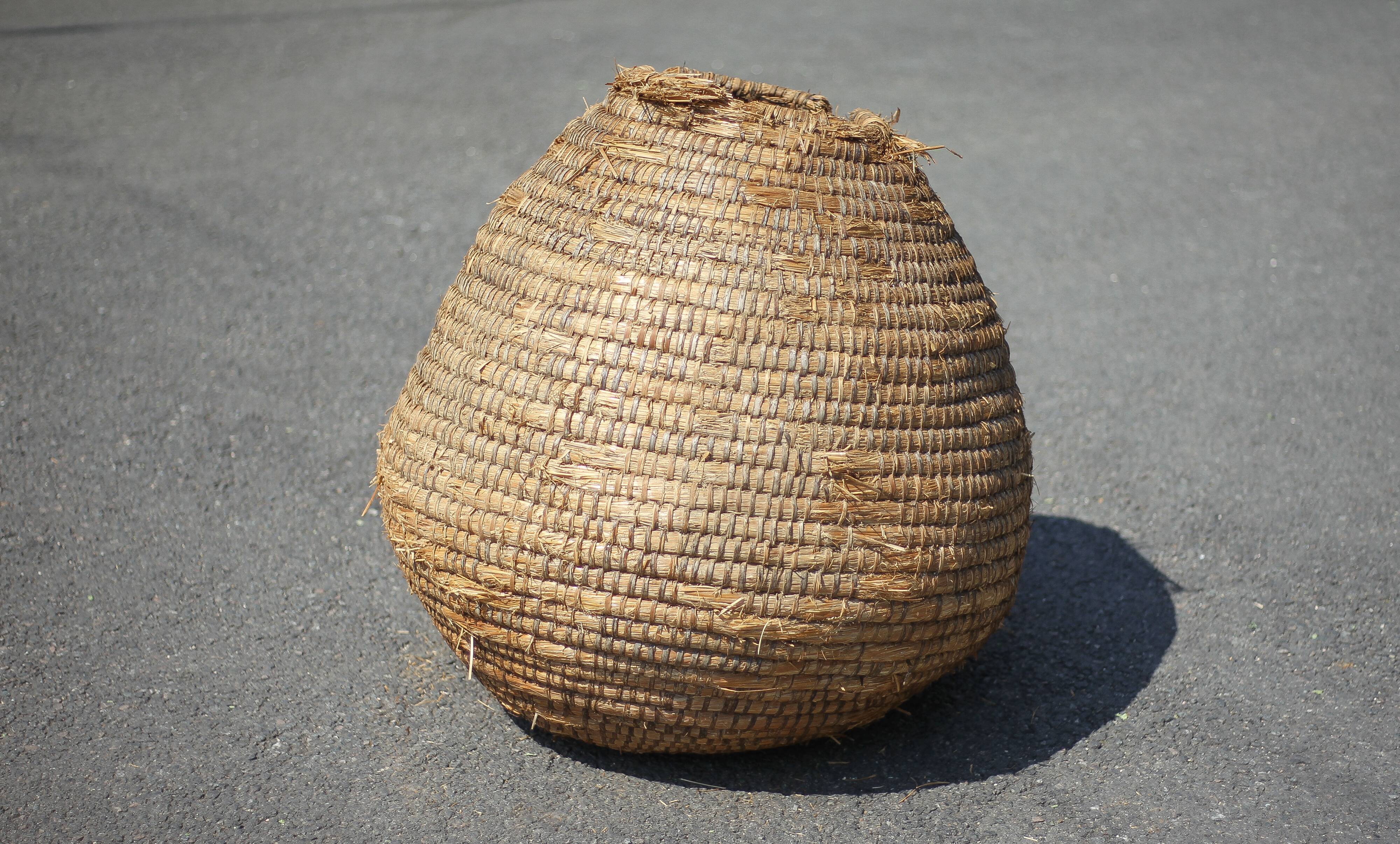 Old basket, burgundy straw and bramble, woven basket, interior decoration
