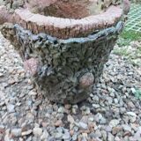 Medicis stone planters with old tree trunk decor