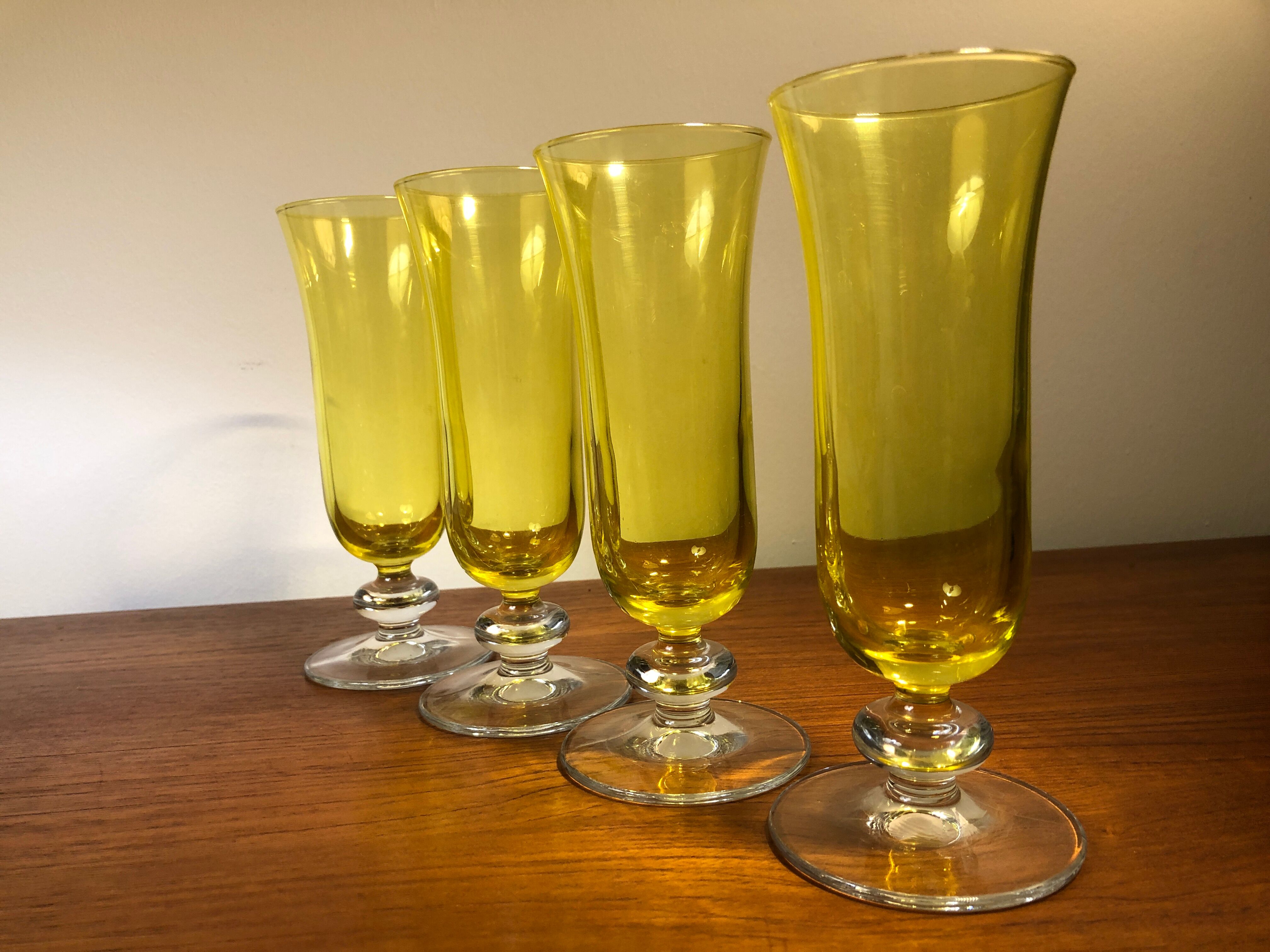 Large transparent yellow champagne flutes