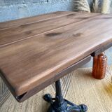 Bistro table with central cast iron leg and rustic top