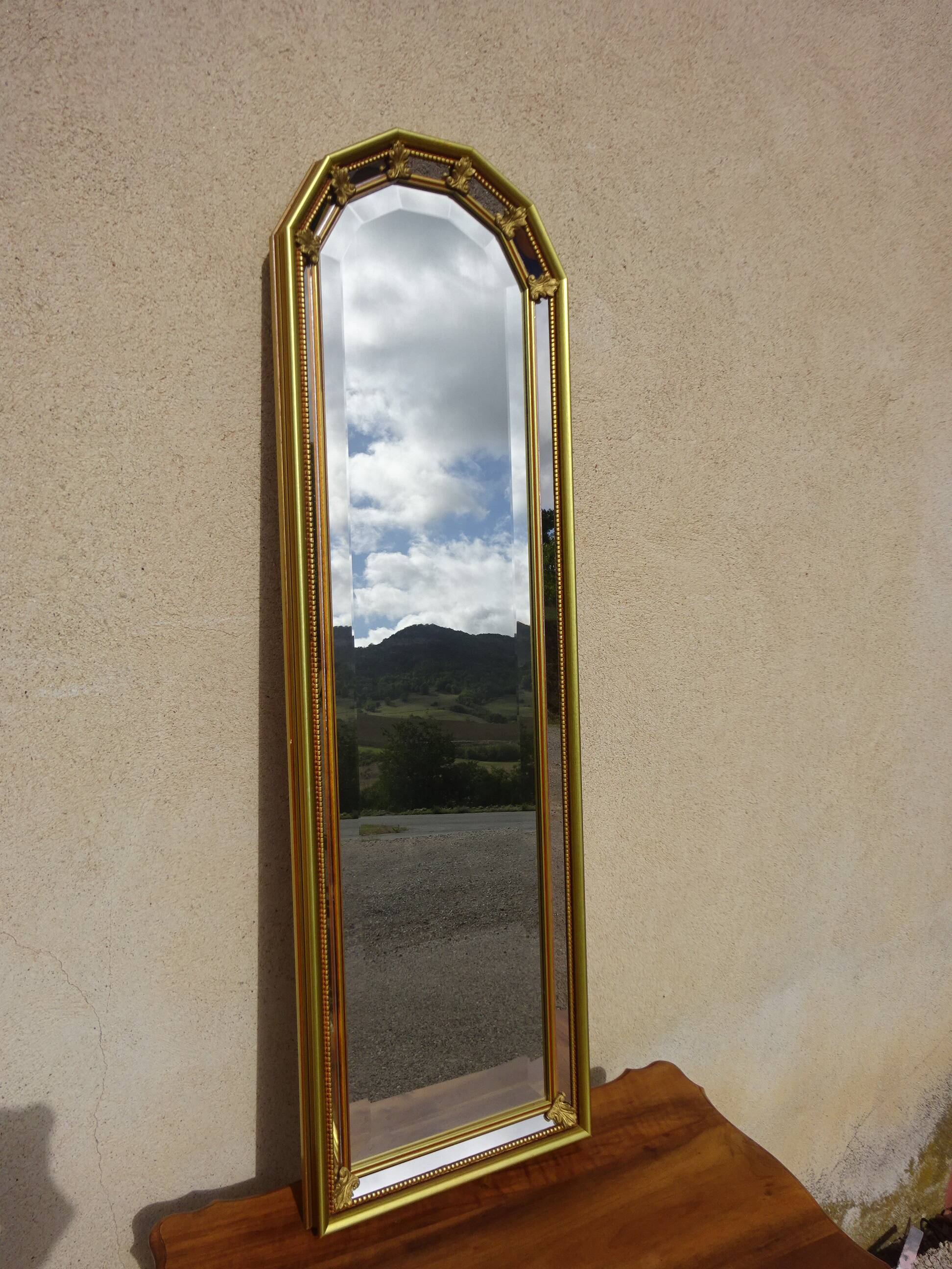Hall mirror, gilded frame with fillets and fleur-de-lis.