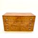 Commode en loupe d’orme et laiton 1970