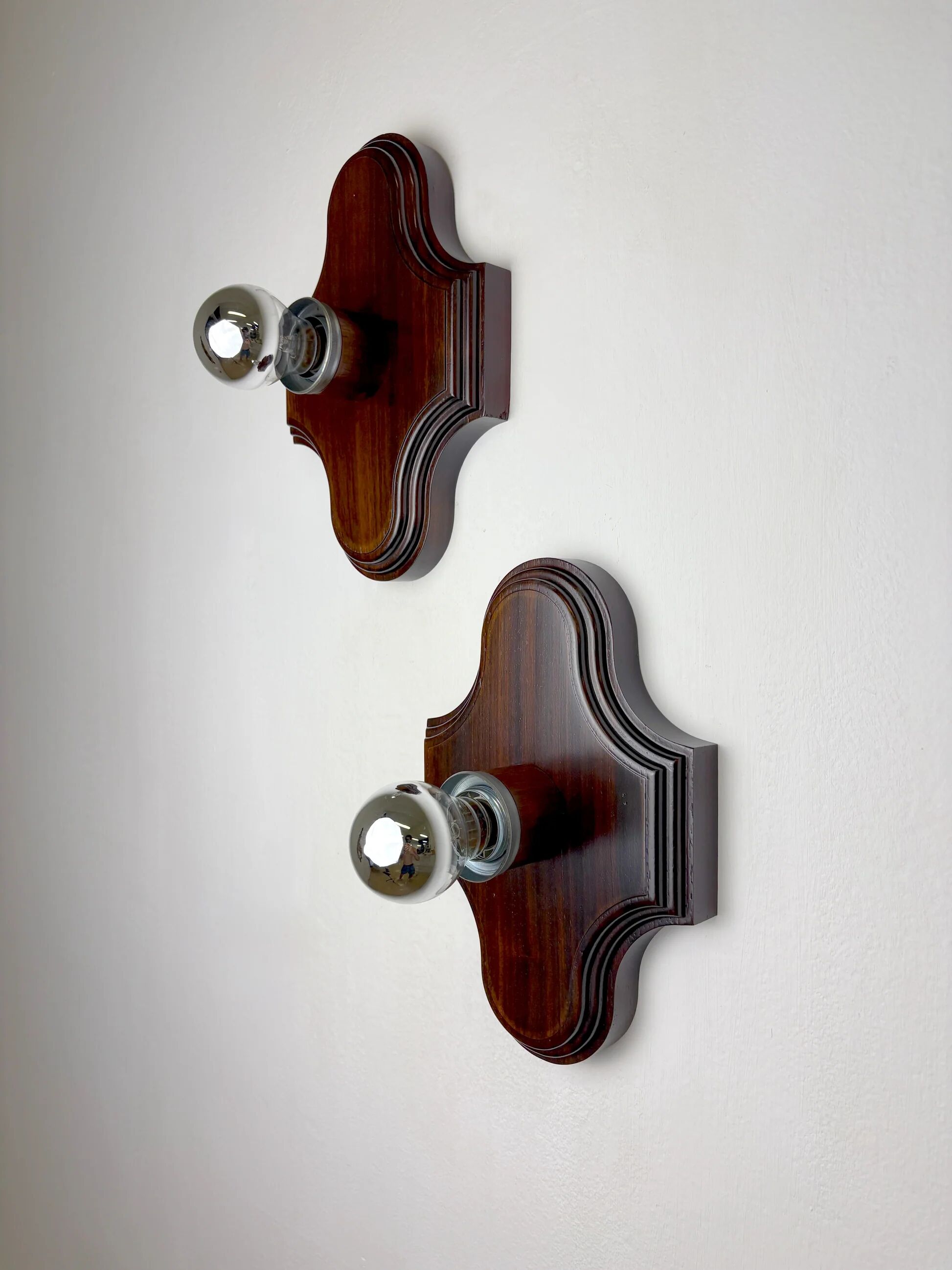 Pair of geometric Art Deco wall lights, carved wood, France, 1960s