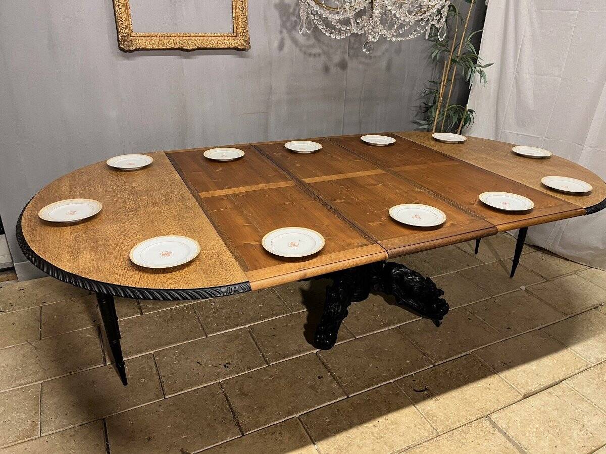 Large oval oak hunting table with central leg and extensions