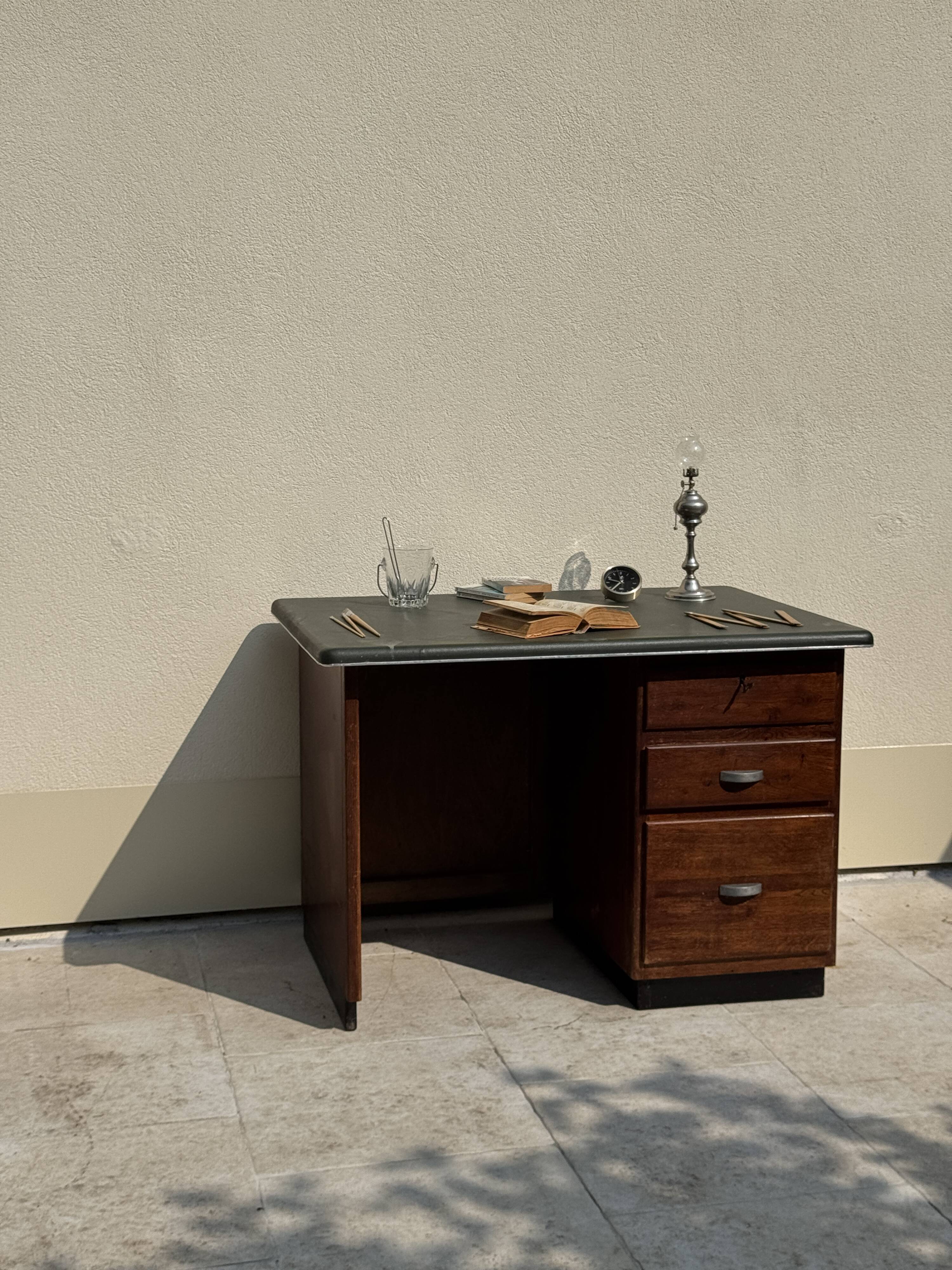 Modernist desk in wood and green moleskin upholstery