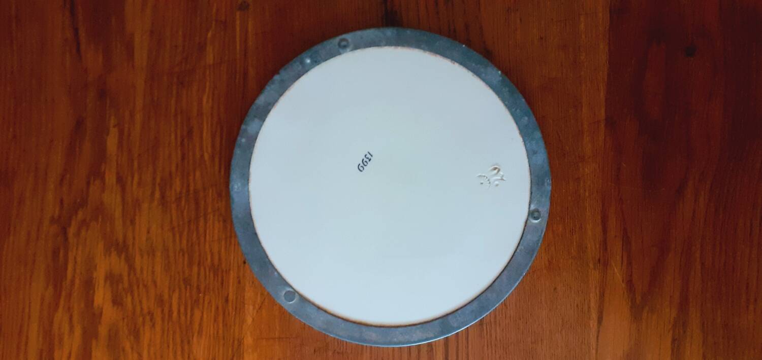 Porcelain and zinc trivet circa 1900