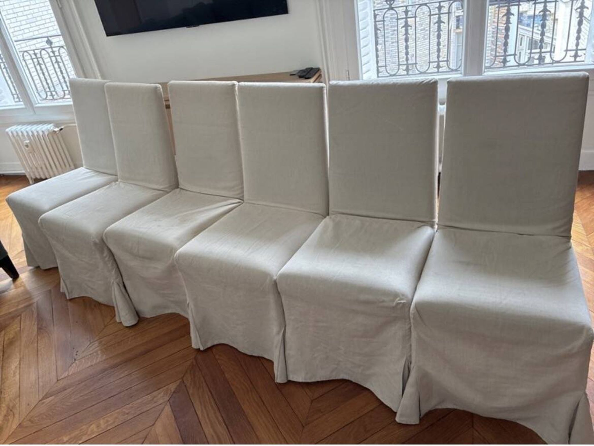 Set of 6 Maxalto chairs with covers.