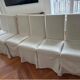 Set of 6 Maxalto chairs with covers.