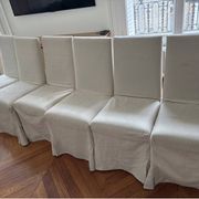 Set of 6 Maxalto chairs with covers.