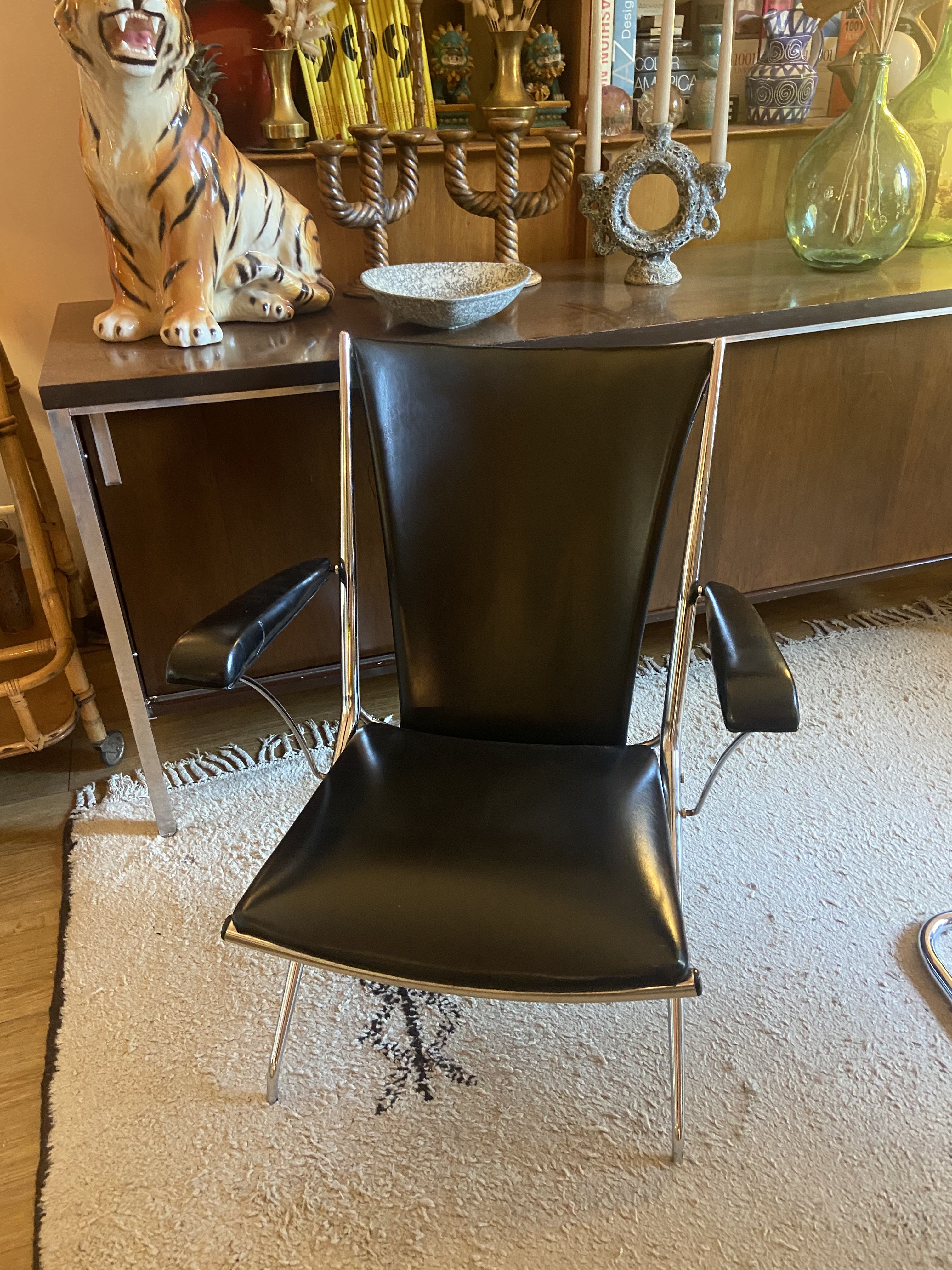 Metal armchair and black skaï