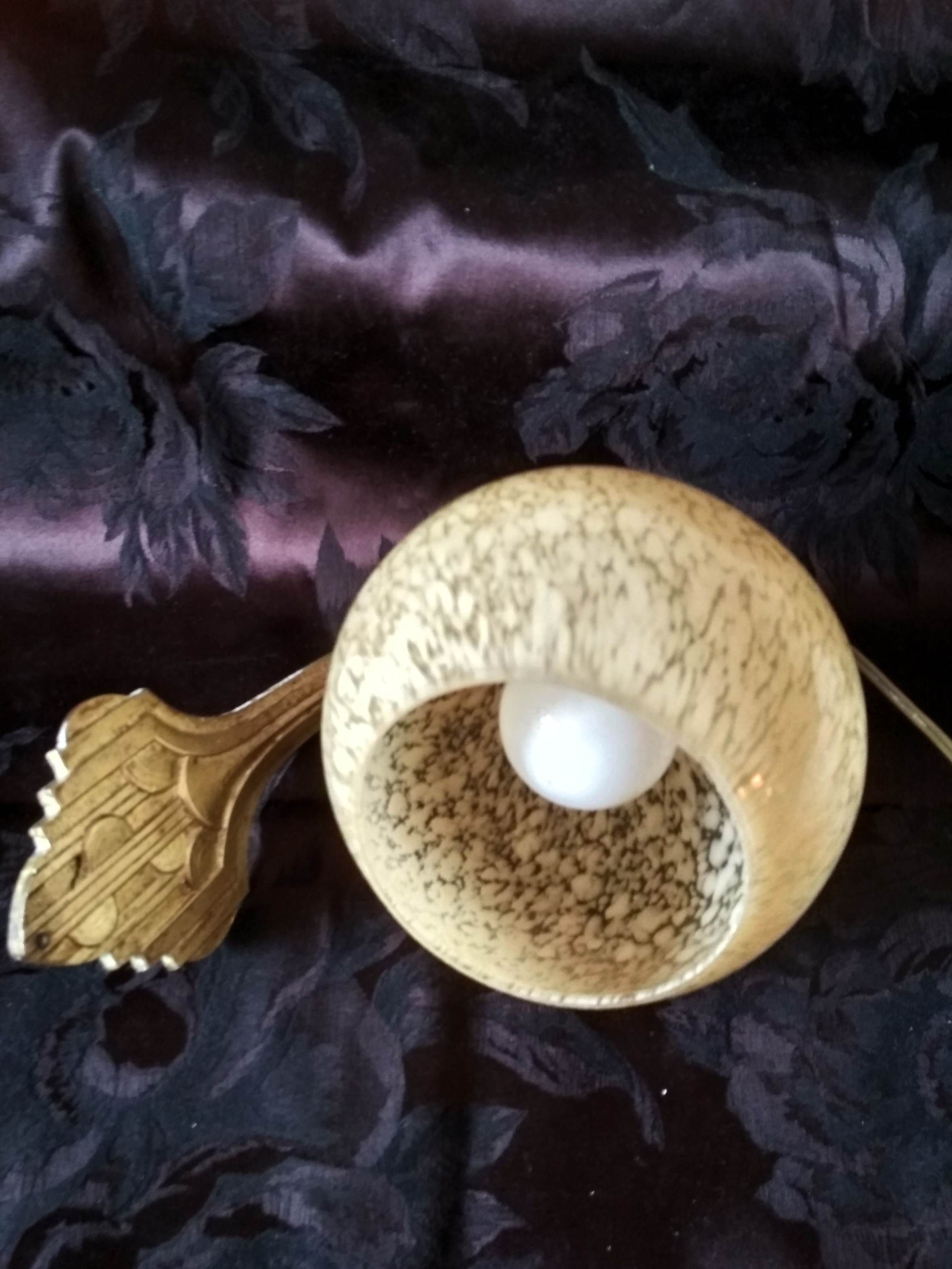 Art deco sconce, golden brass and yellow speckled Clichy glass globe