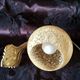 Art deco sconce, golden brass and yellow speckled Clichy glass globe