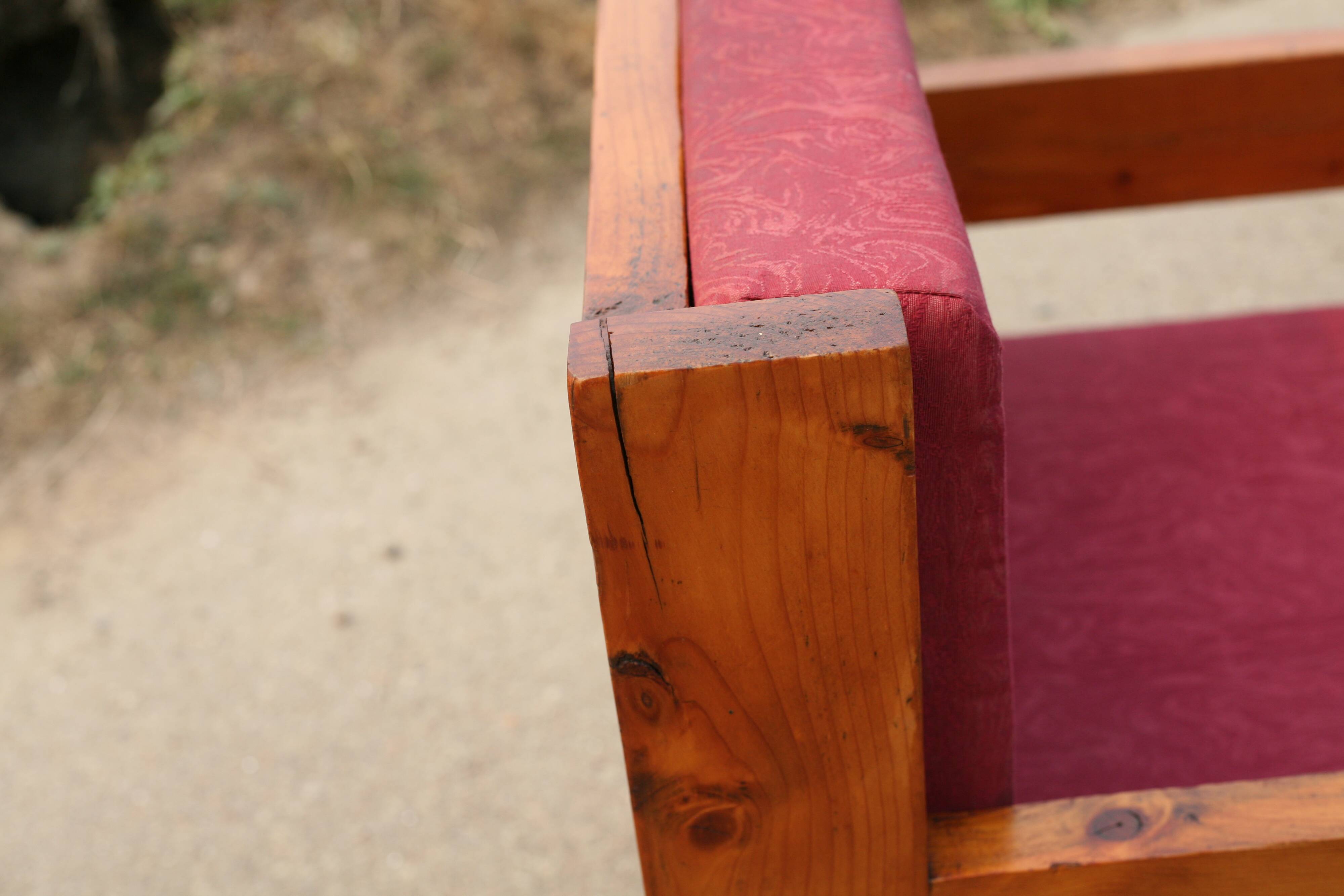 Pair of pine fireside chairs, France, 1960s, "raspberry" cushions