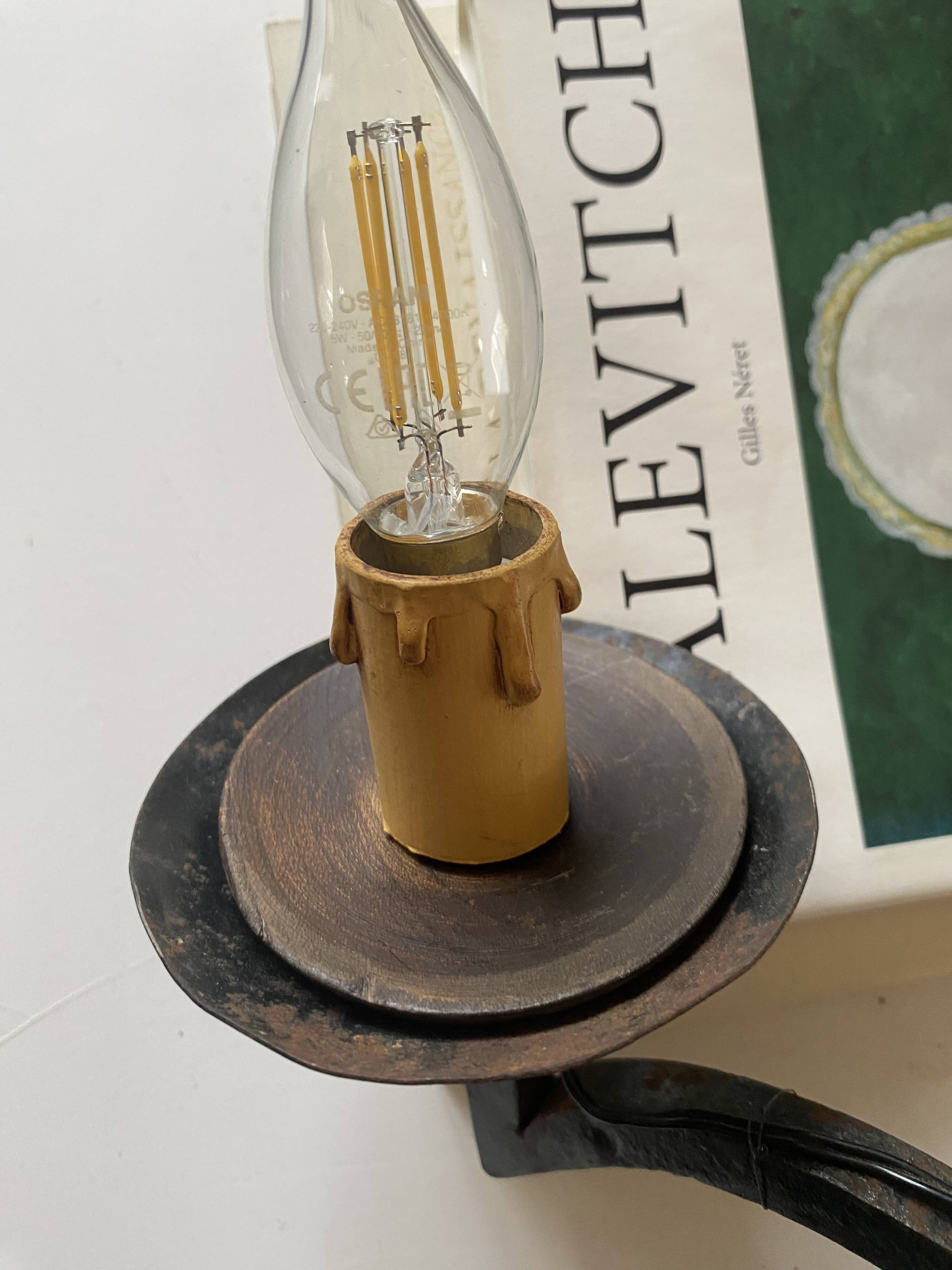 Wrought iron wall lights.