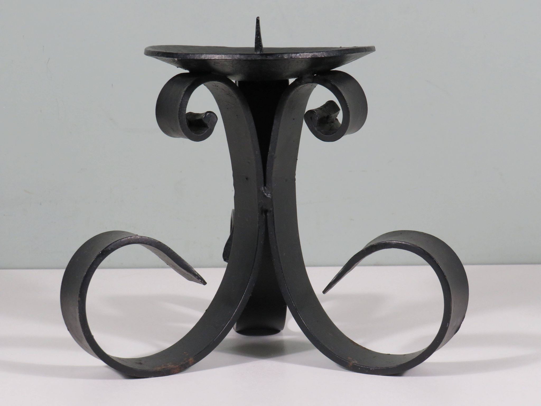 Vintage wrought iron chandelier for large candle.