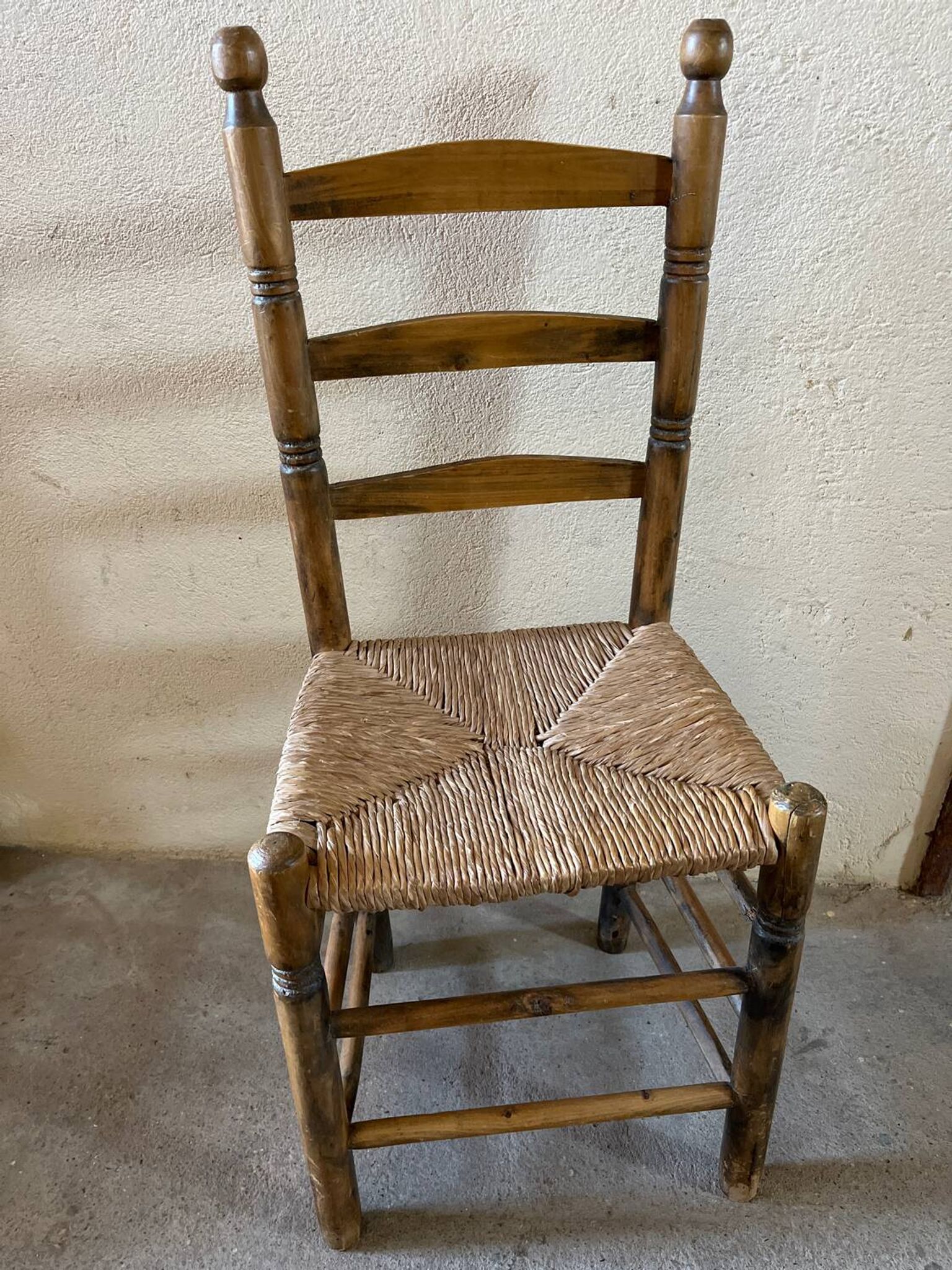 Old turned and stuffed wooden chair