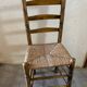 Old turned and stuffed wooden chair