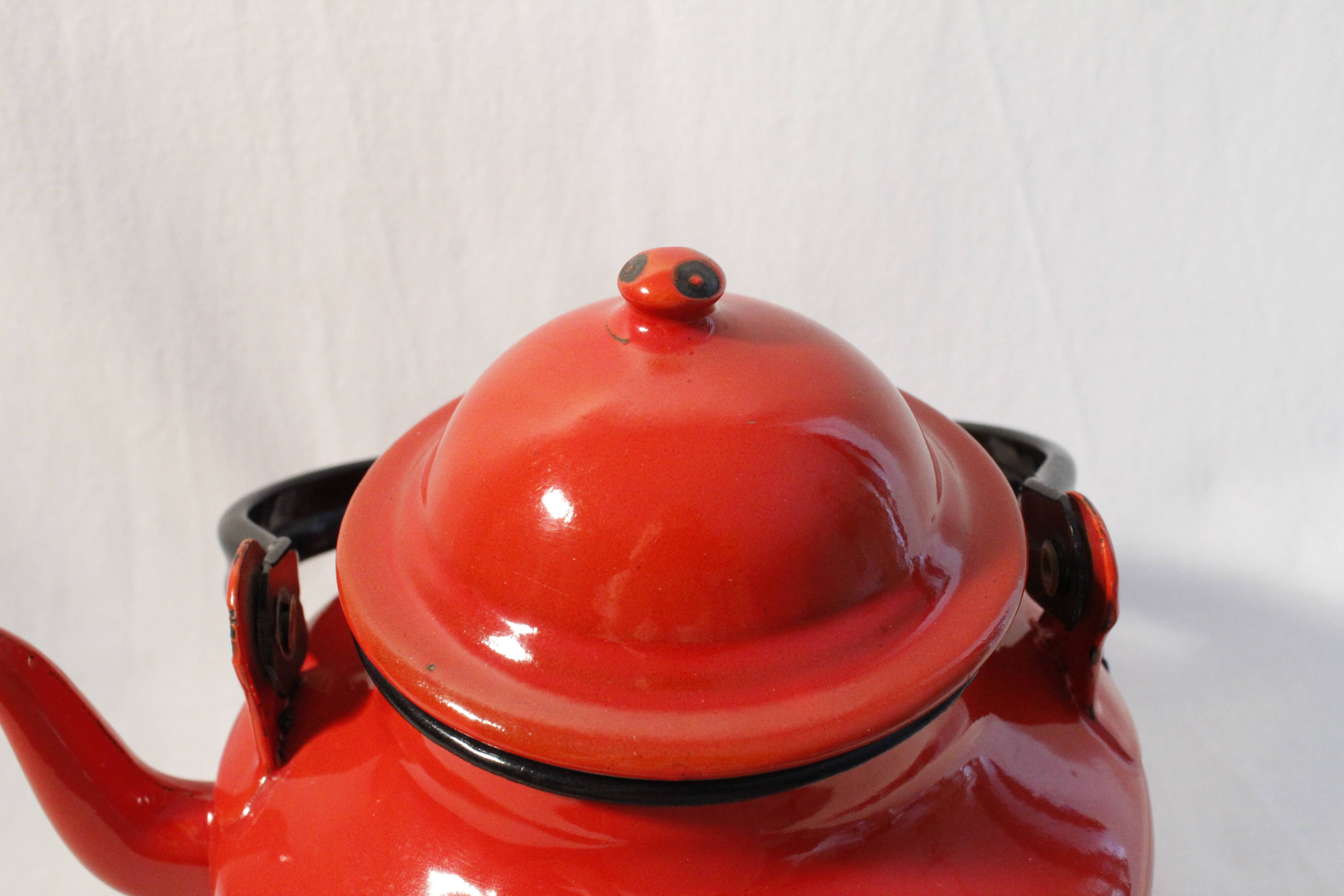 Vintage red enamelled metal kettle
