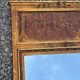 Golden trumeau mirror in Louis XVI style, 20th century.